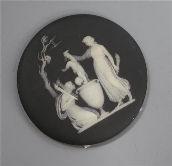 A 19th century black basalt Wedgwood medallion diameter 8cm